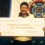 Reyes holds the winning check.